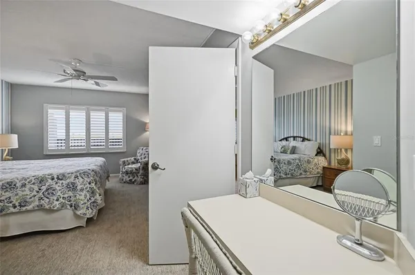 a bedroom with a bed and a couch