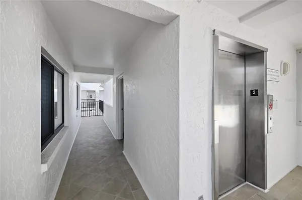 a hallway with wooden floor