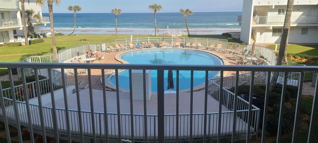 815 Ocean Shore Boulevard, Unit 7A Ormond Beach, FL 32176 - Photo 1 of 16 a view of swimming pool with outdoor seating