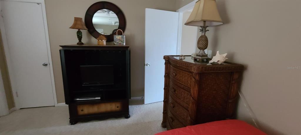 815 Ocean Shore Boulevard, Unit 7A Ormond Beach, FL 32176 - Photo 6 of 16 a view of living room with furniture and a mirror