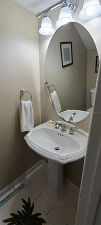 a bathroom with a sink and mirror