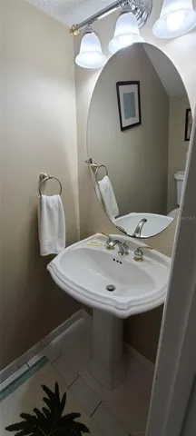 a bathroom with a sink and mirror