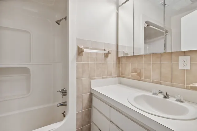 a bathroom with a sink and a bathtub