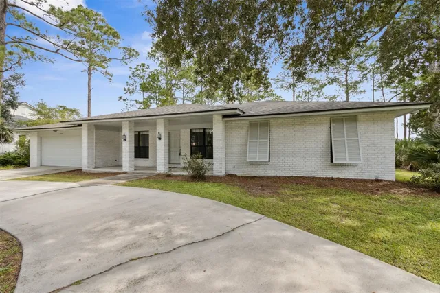 a house with trees in the background