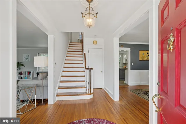 a view of a room with wooden floor and stairs