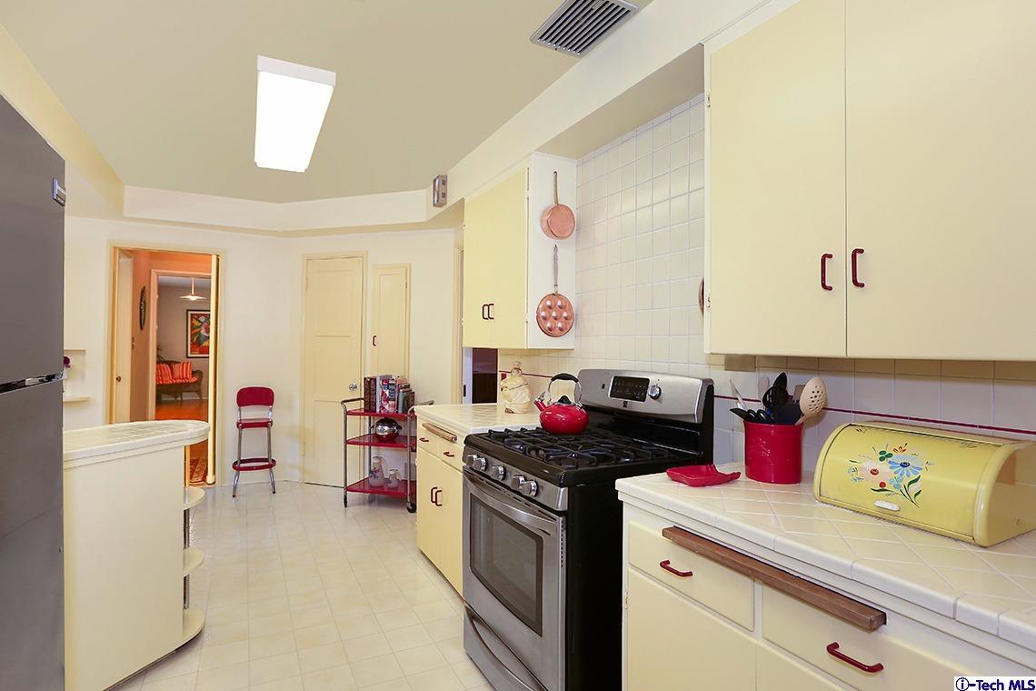 841 West Roses Road San Gabriel, CA 91775 - Photo 11 of 24 a kitchen with a stove and cabinets