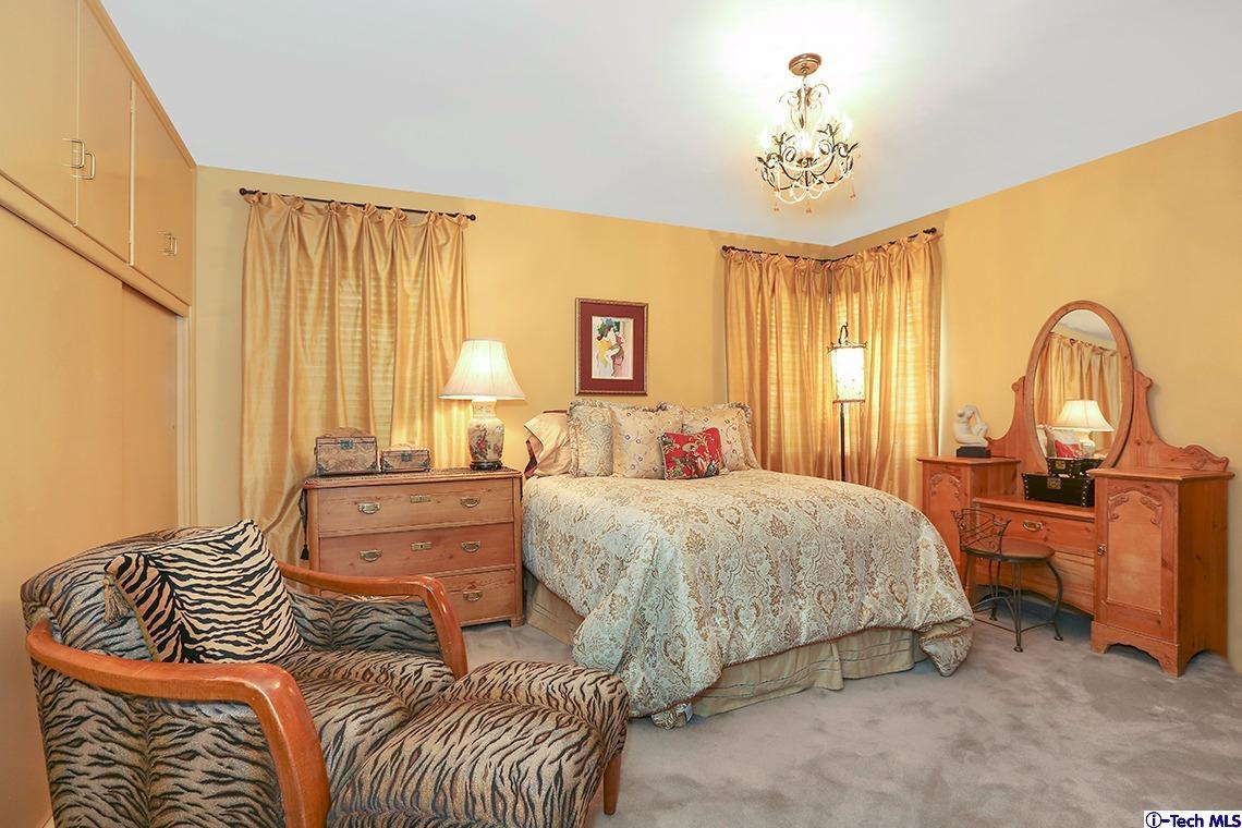 841 West Roses Road San Gabriel, CA 91775 - Photo 14 of 24 a bedroom with a bed lamps and window