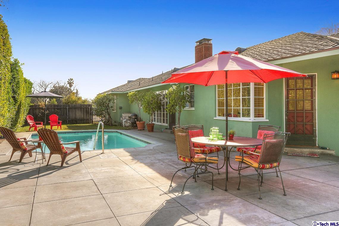841 West Roses Road San Gabriel, CA 91775 - Photo 20 of 24 a view of a patio with a table and chairs under an umbrella