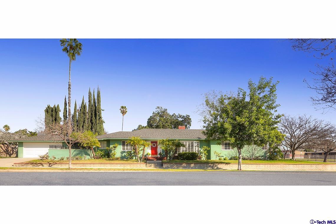 841 West Roses Road San Gabriel, CA 91775 - Photo 3 of 24 a view of a swimming pool with a lawn chairs under an umbrella