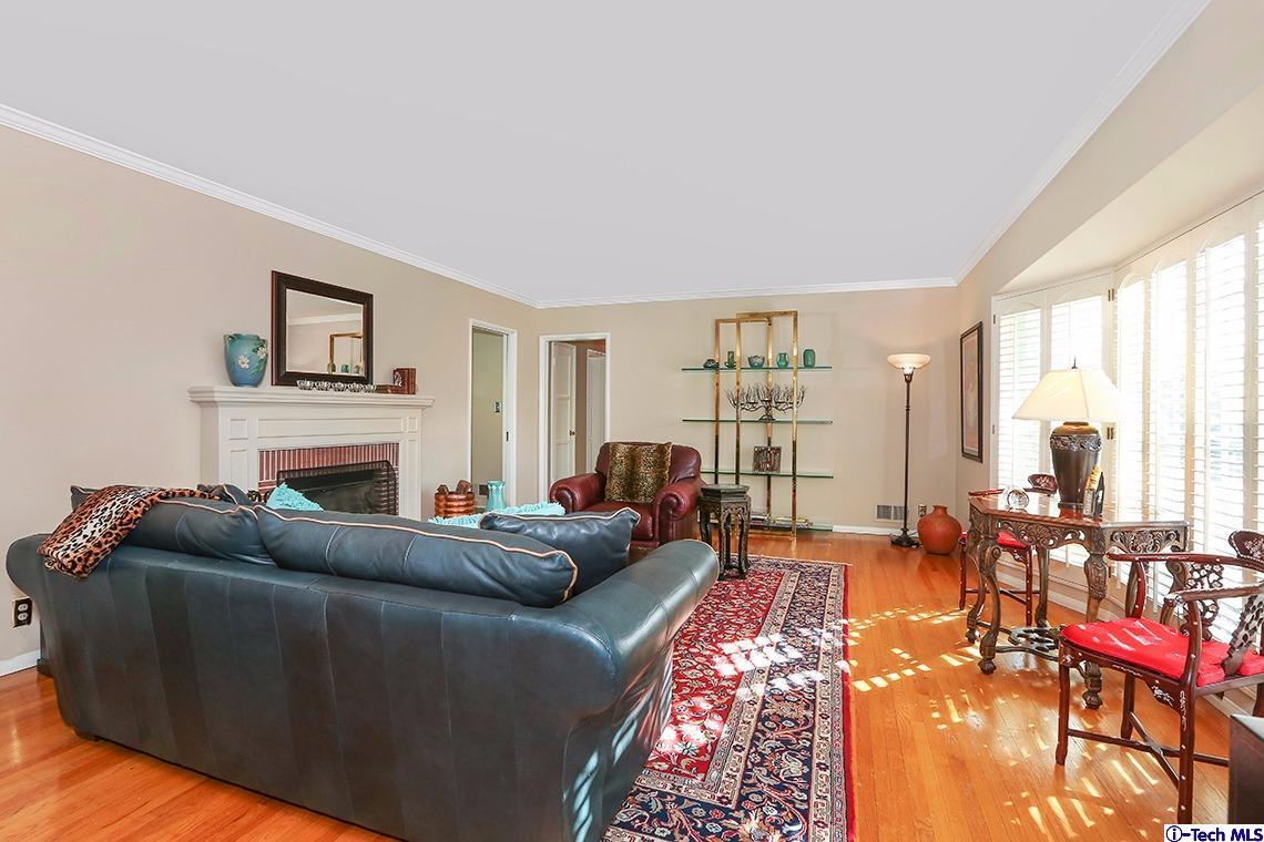 841 West Roses Road San Gabriel, CA 91775 - Photo 6 of 24 a living room with furniture large window and a fireplace
