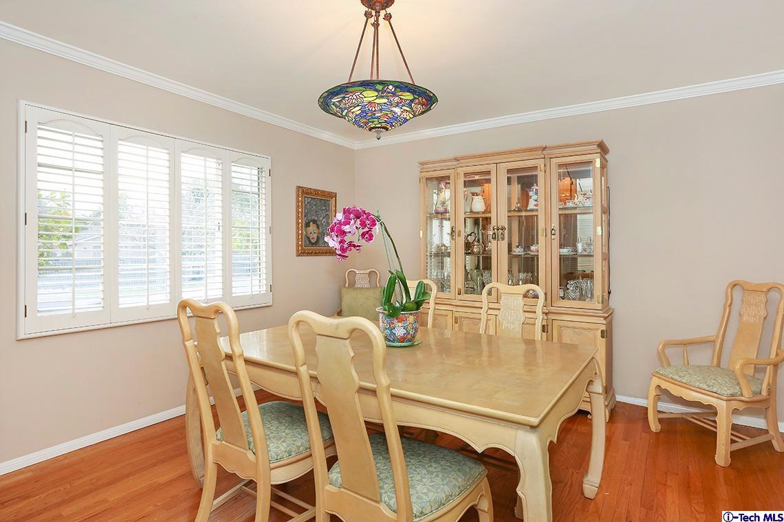 841 West Roses Road San Gabriel, CA 91775 - Photo 7 of 24 a dining room with furniture a chandelier and wooden floor