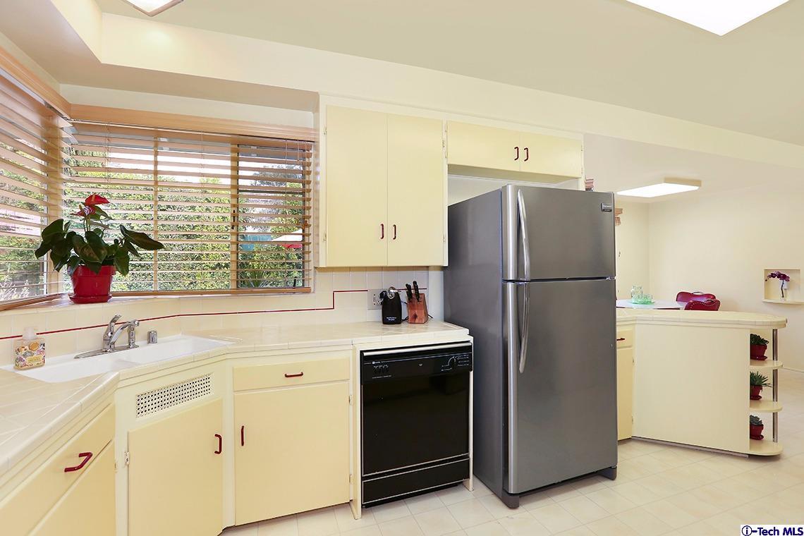 841 West Roses Road San Gabriel, CA 91775 - Photo 10 of 24 a kitchen with a refrigerator and a sink