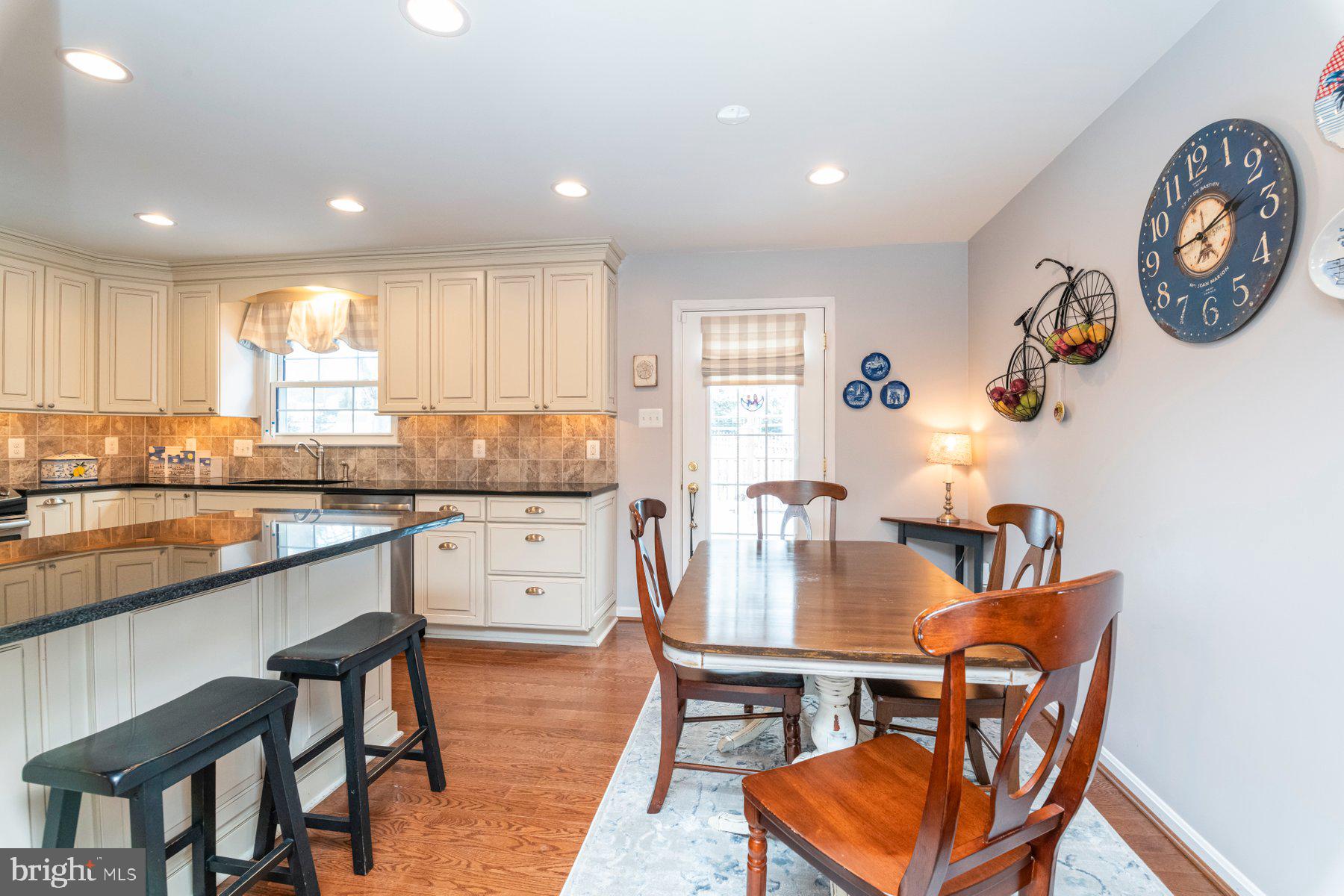 9078 Waltham Woods Road Baltimore, MD 21234 - Photo 11 of 38 Main level - kitchen/dining room & door to deck