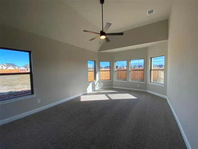 a large bathroom with a granite countertop sink a toilet and shower