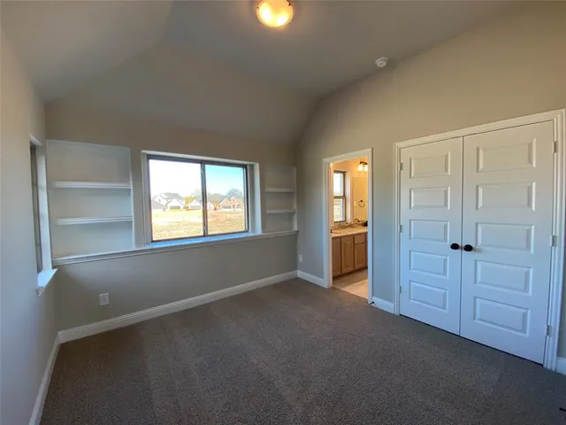 a bathroom with a toilet and a bathtub