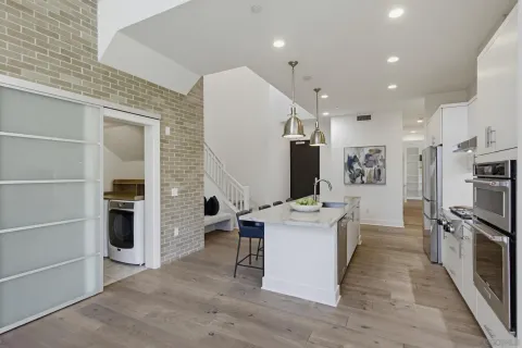 a stove top oven sitting inside of a kitchen