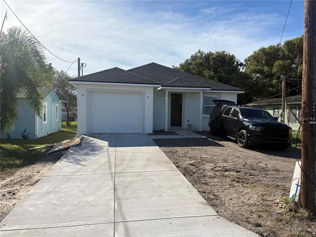 a view of a car park in front of house
