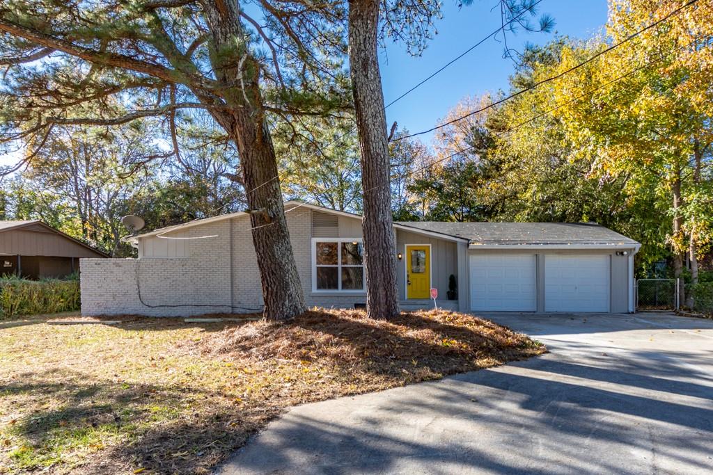 3848 Brookcrest Circle Decatur, GA 30032 - Photo 1 of 1 a view of wooden house with a large tree