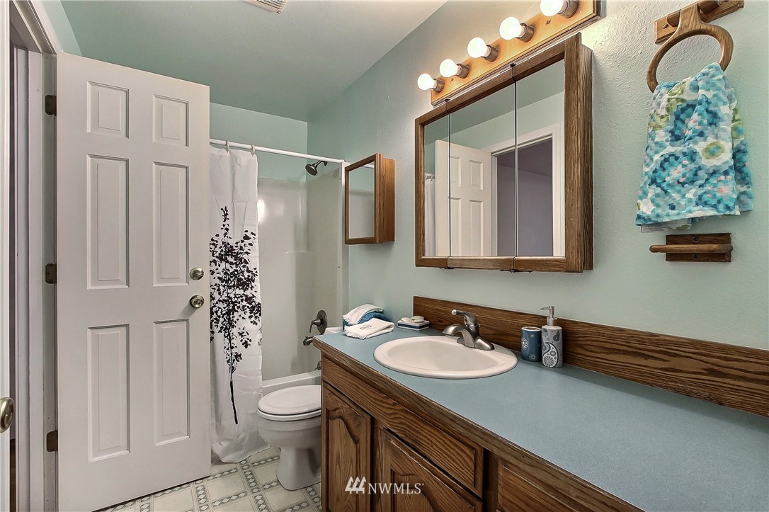 7370 Bordeaux Road Southwest Olympia, WA 98512 - Photo 11 of 25 a bathroom with a sink a toilet and shower