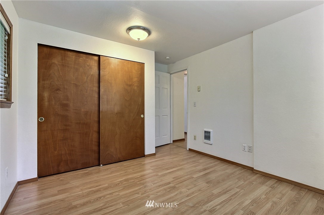 7370 Bordeaux Road Southwest Olympia, WA 98512 - Photo 13 of 25 an empty room with wooden floor and windows