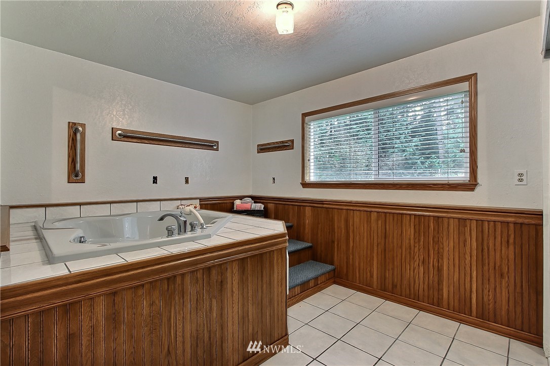 7370 Bordeaux Road Southwest Olympia, WA 98512 - Photo 17 of 25 a bathroom with a sink and a window