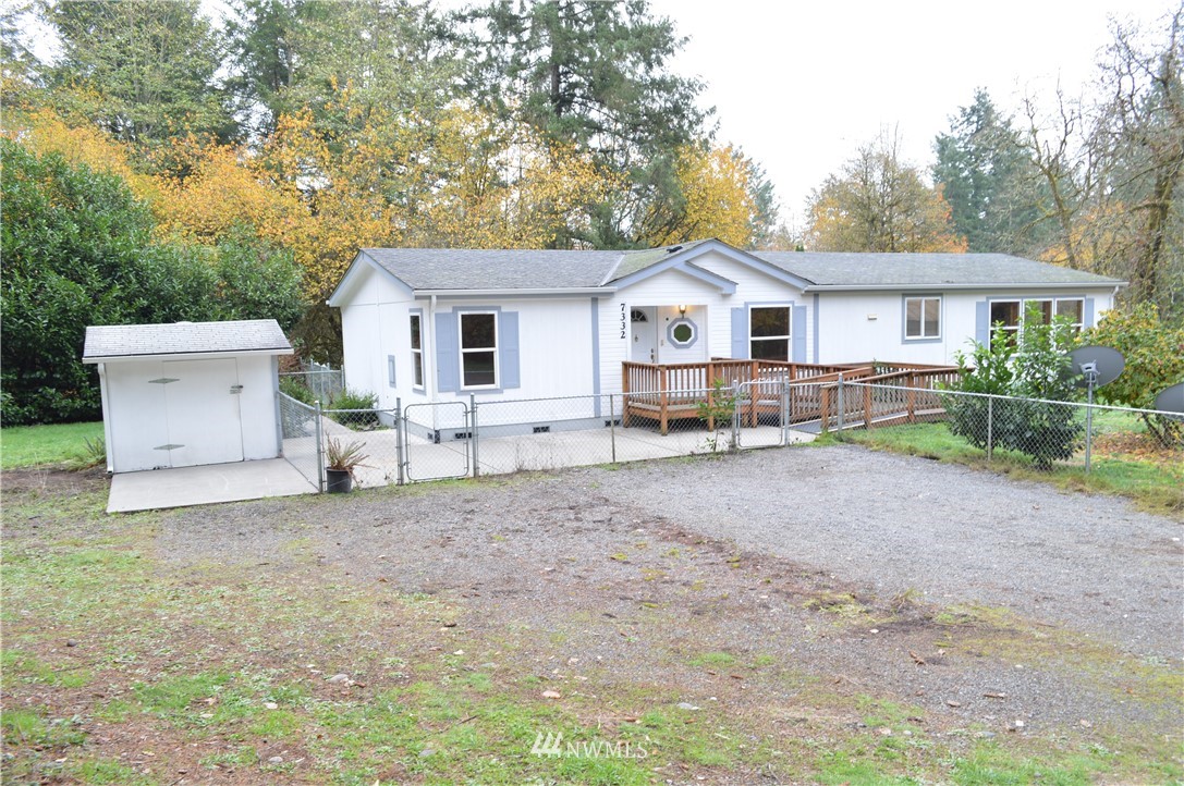 7370 Bordeaux Road Southwest Olympia, WA 98512 - Photo 19 of 25 a view of a house with a yard and large tree