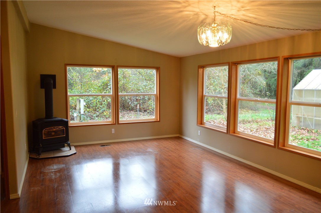 7370 Bordeaux Road Southwest Olympia, WA 98512 - Photo 22 of 25 a view of livingroom with furniture and a window