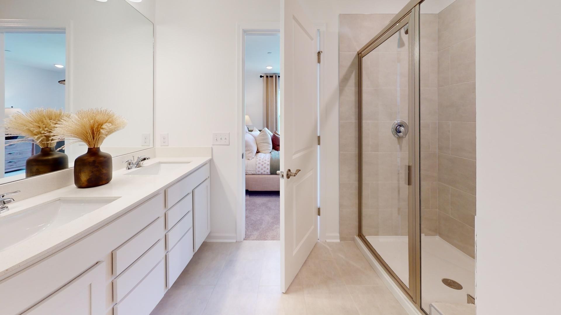 7112 Mapleside Lane Fairview, TN 37062 - Photo 30 of 49 a en suite bathroom with a double vanity sink and mirror