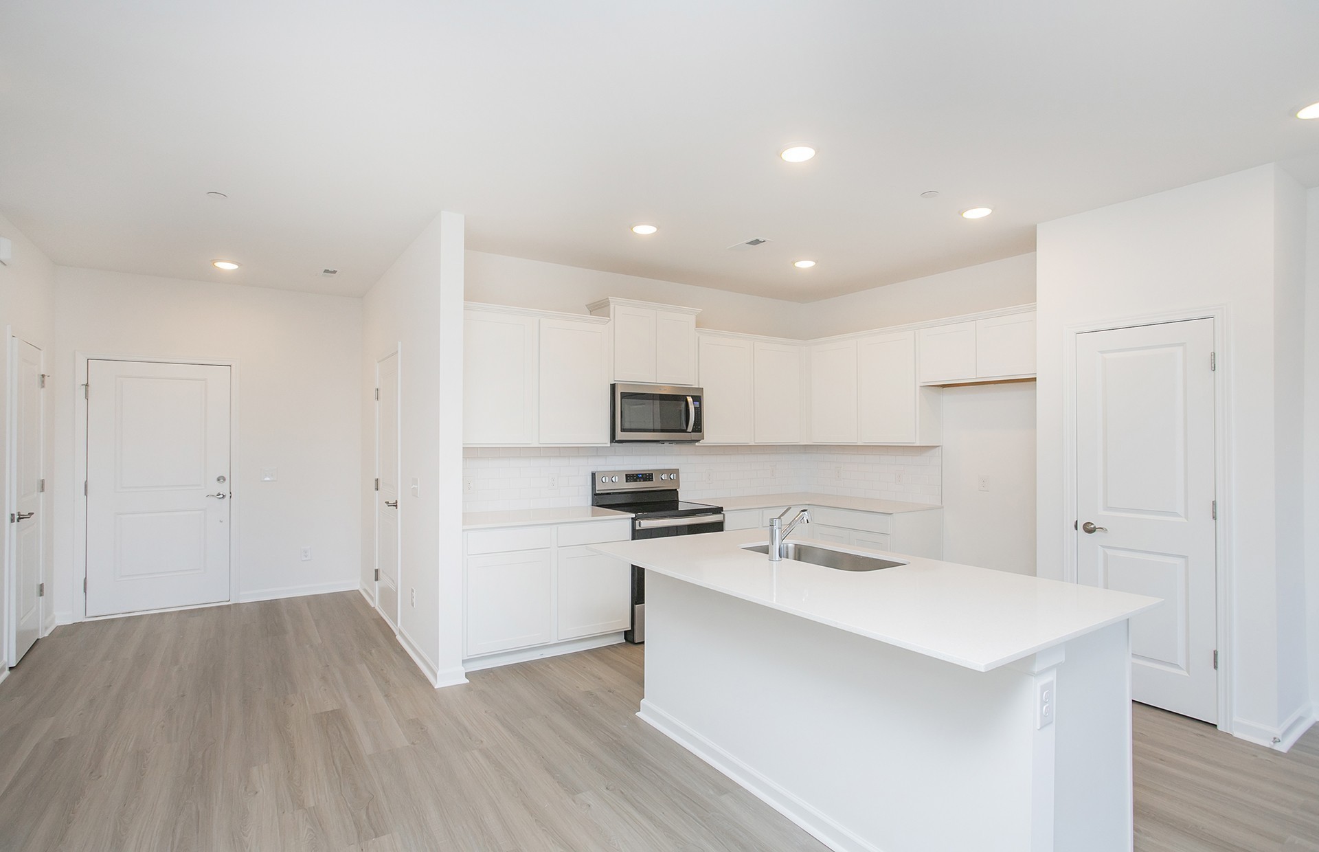 7112 Mapleside Lane Fairview, TN 37062 - Photo 6 of 49 a kitchen with a sink a counter top space stainless steel appliances and cabinets