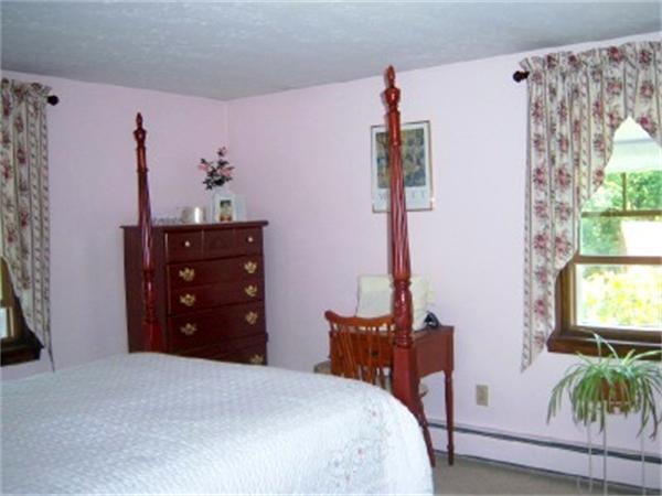 15 Squareshire Road Sterling, MA 01564 - Photo 16 of 30 a bedroom with a bed and a flat tv screen on dresser