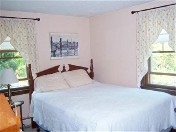 15 Squareshire Road Sterling, MA 01564 - Photo 18 of 30 a bedroom with a large bed and a window