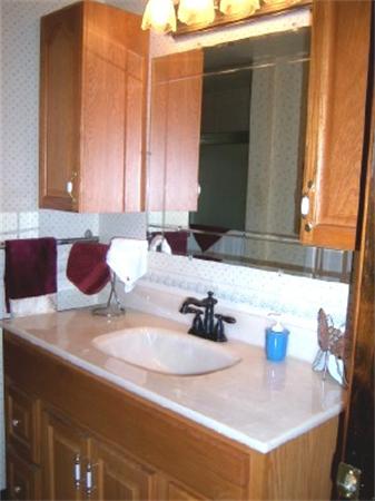 15 Squareshire Road Sterling, MA 01564 - Photo 20 of 30 a bathroom with a sink and a mirror