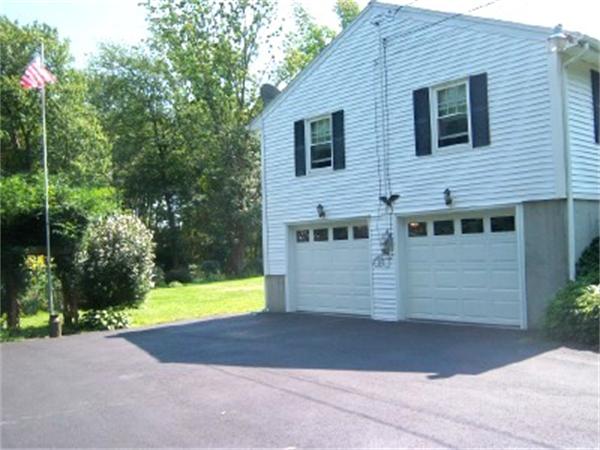 15 Squareshire Road Sterling, MA 01564 - Photo 3 of 30 a front view of a house with a yard and garage