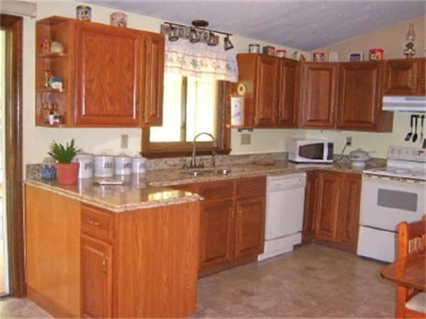 15 Squareshire Road Sterling, MA 01564 - Photo 6 of 30 a kitchen with stainless steel appliances granite countertop a sink a stove cabinets and a window