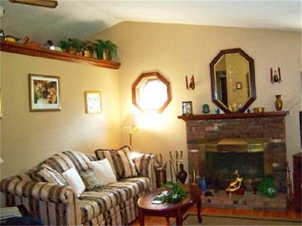 15 Squareshire Road Sterling, MA 01564 - Photo 9 of 30 a living room with furniture and a fireplace