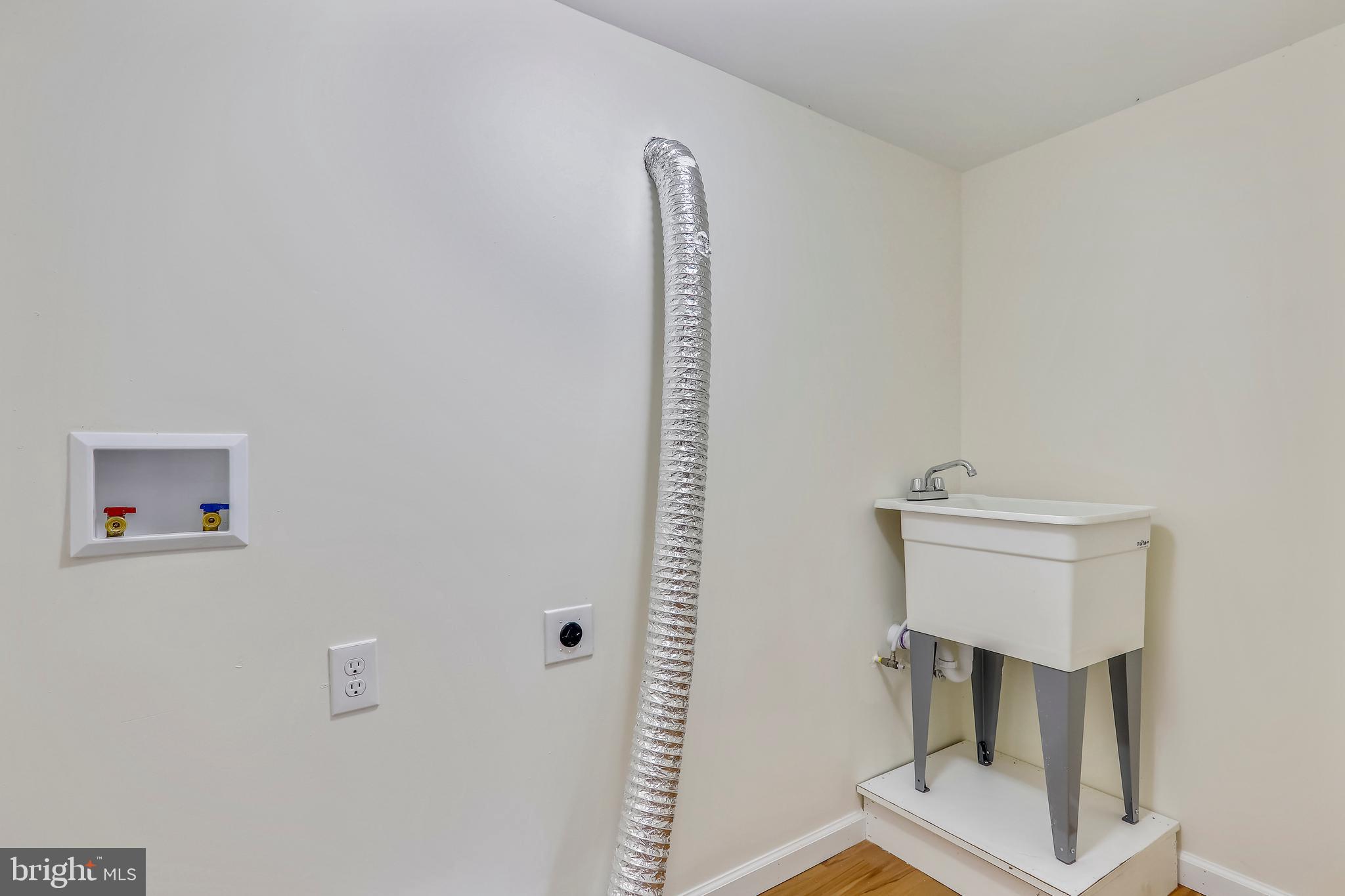 1509 Forest Glen Road Silver Spring, MD 20902 - Photo 22 of 29 Utility Room With Laundry Sink