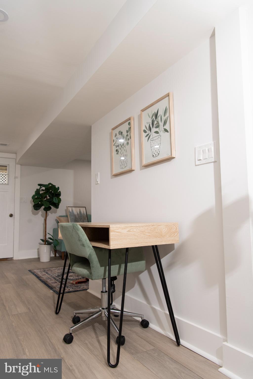 3309 22nd Street Northeast Washington, DC 20018 - Photo 12 of 36 a workspace with furniture and wooden floor