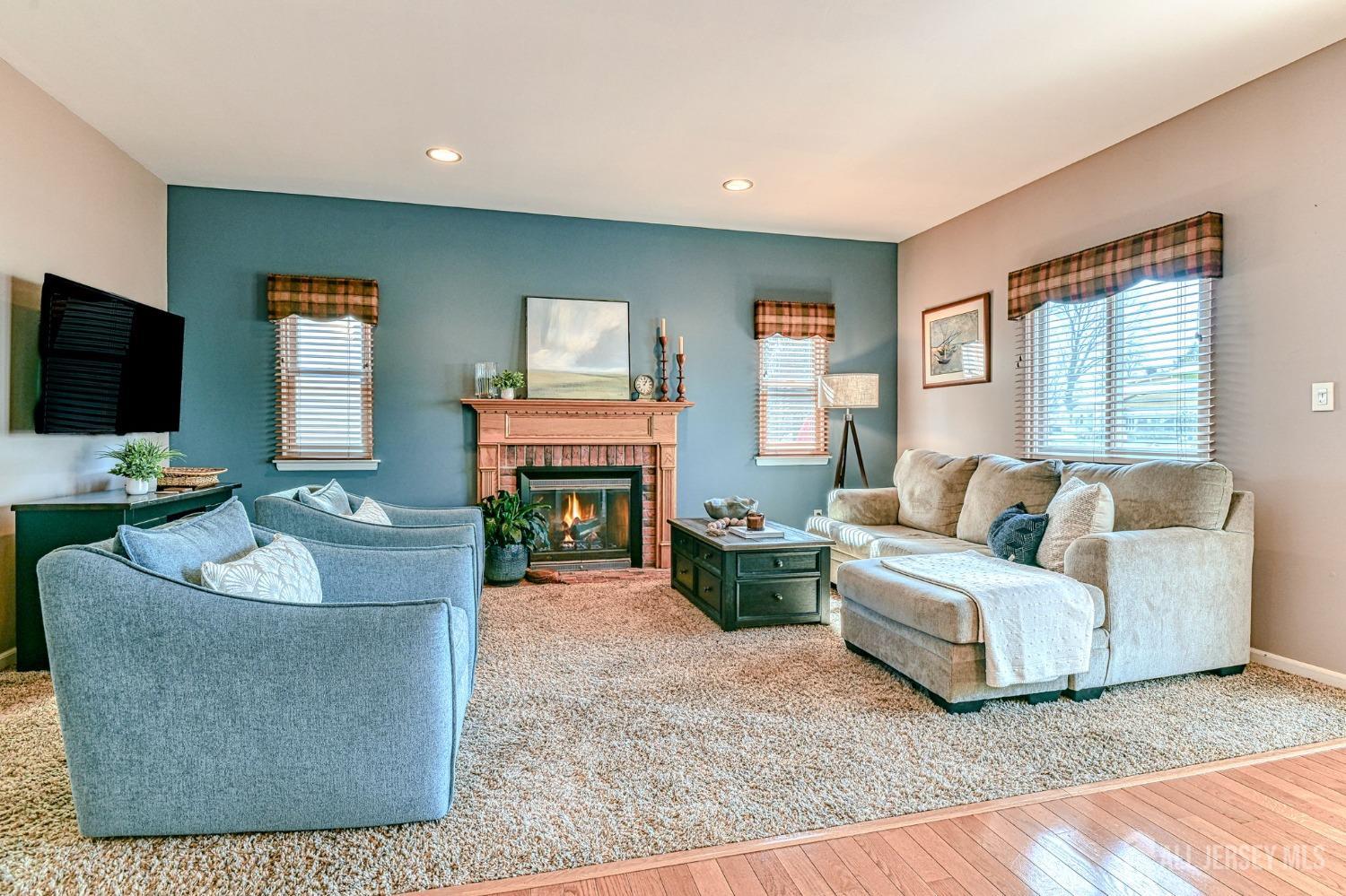 10 Graulich Drive Milltown, NJ 08850 - Photo 11 of 40 a living room with furniture and a flat screen tv