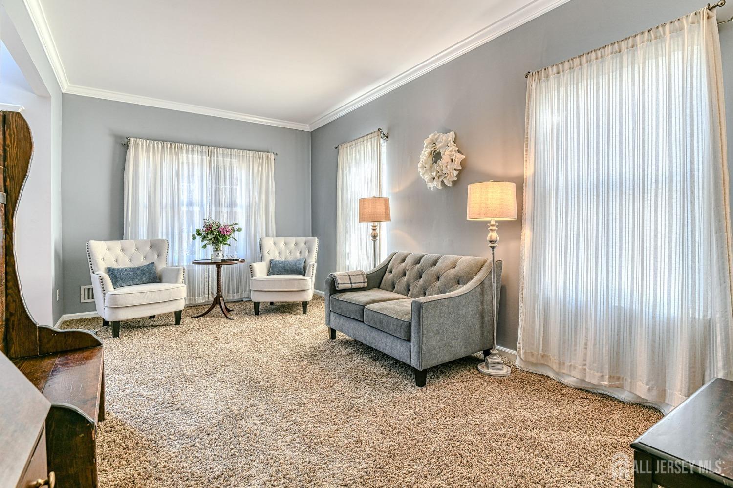 10 Graulich Drive Milltown, NJ 08850 - Photo 15 of 40 a living room with furniture and a window