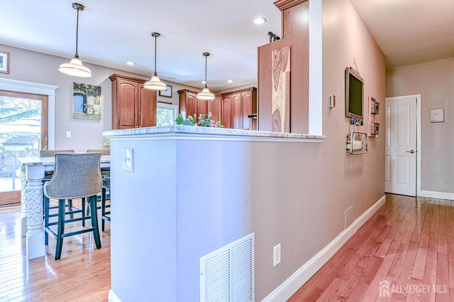10 Graulich Drive Milltown, NJ 08850 - Photo 17 of 40 a view of a kitchen with wooden floor and a window