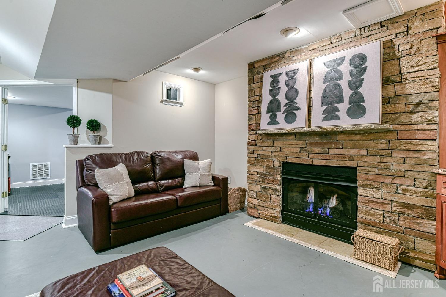10 Graulich Drive Milltown, NJ 08850 - Photo 21 of 40 a living room with furniture and a fireplace