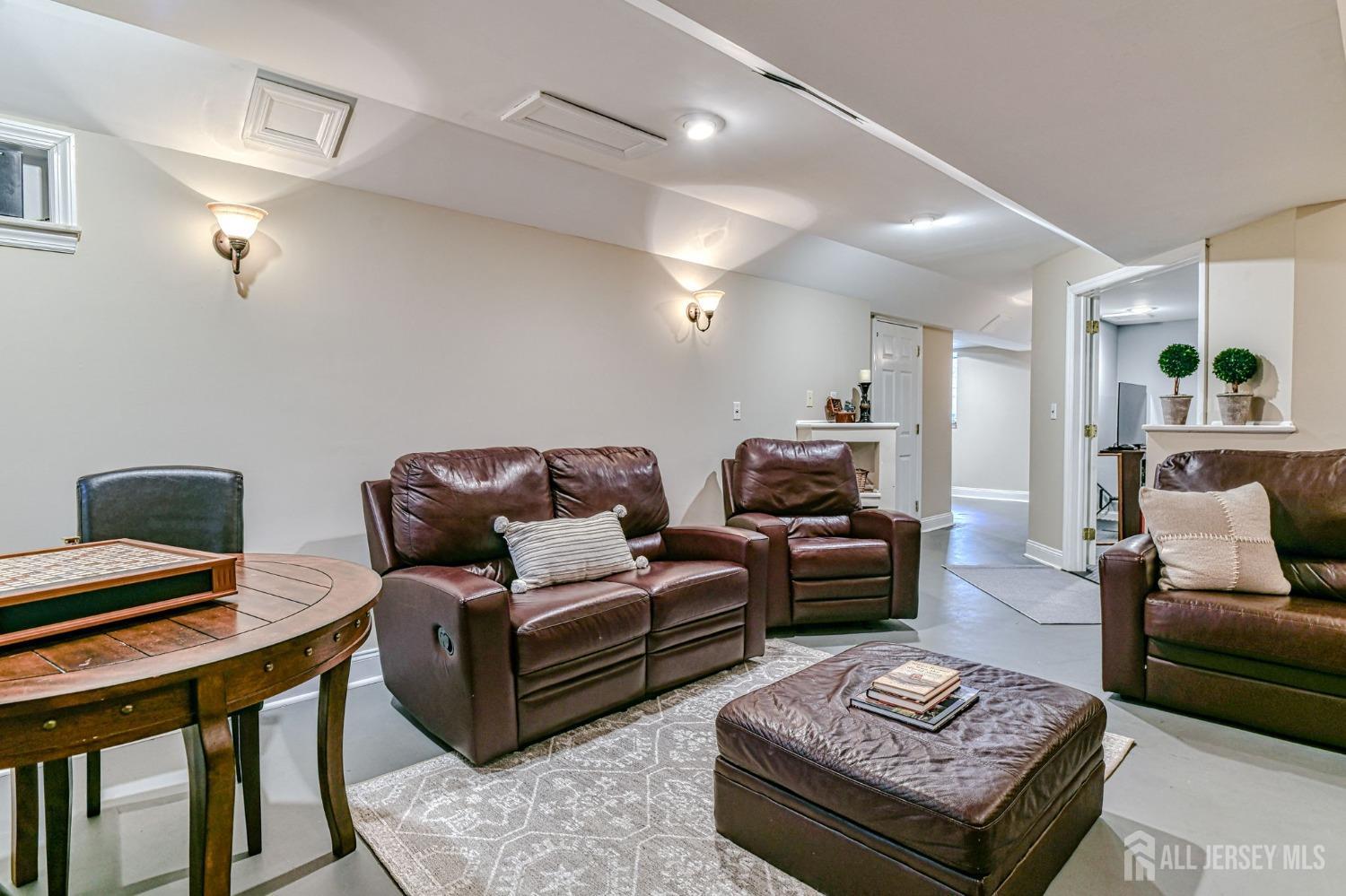 10 Graulich Drive Milltown, NJ 08850 - Photo 22 of 40 a living room with furniture and wooden floor