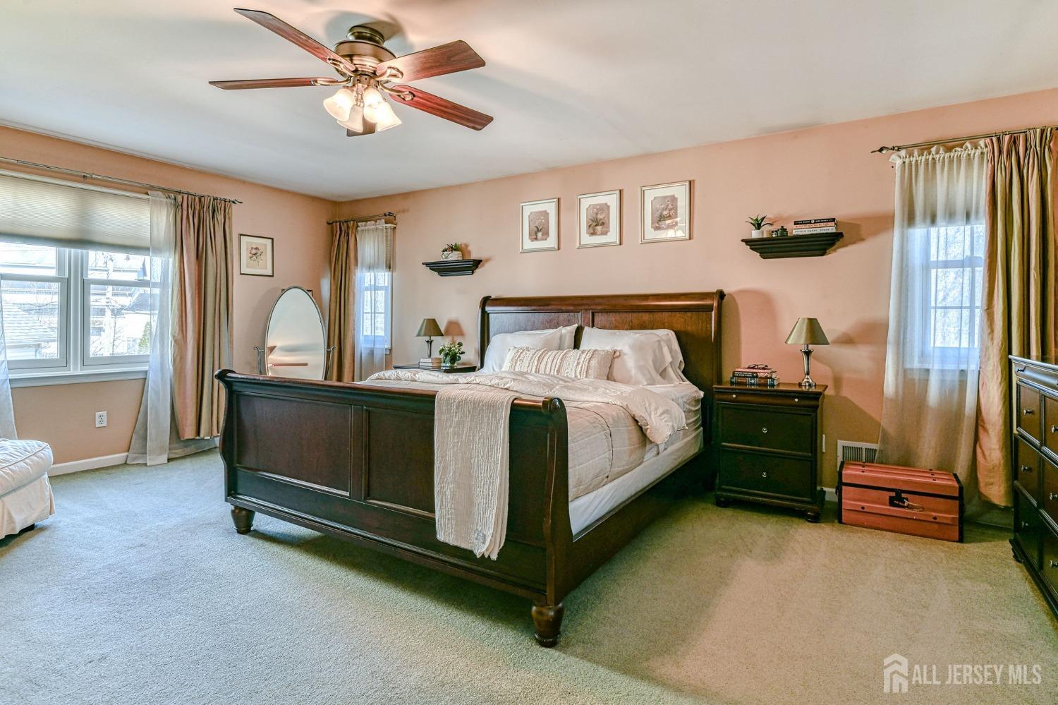 10 Graulich Drive Milltown, NJ 08850 - Photo 27 of 40 a bedroom with a bed and a chandelier