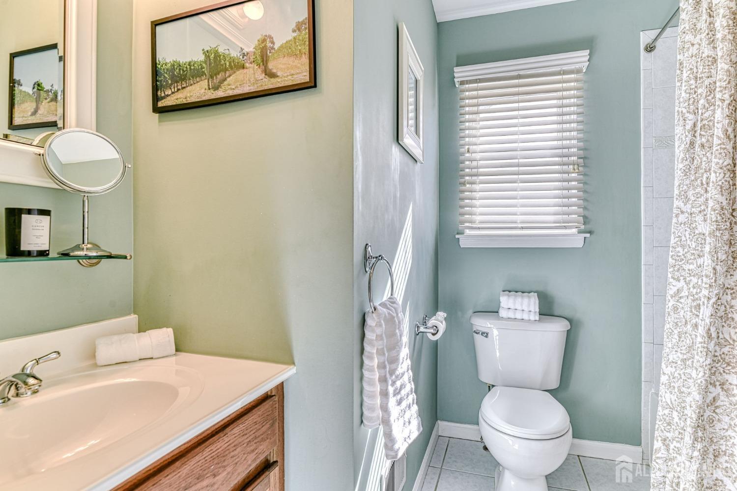 10 Graulich Drive Milltown, NJ 08850 - Photo 34 of 40 a bathroom with a toilet sink and mirror