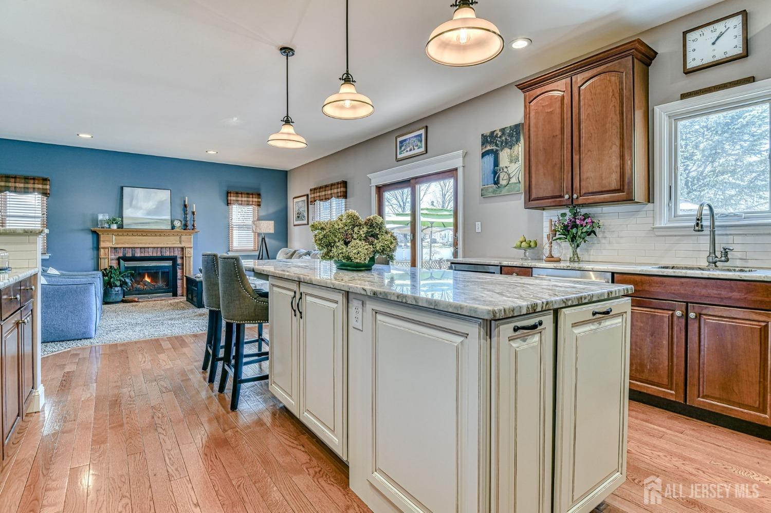 10 Graulich Drive Milltown, NJ 08850 - Photo 9 of 40 a kitchen with sink cabinets and wooden floor