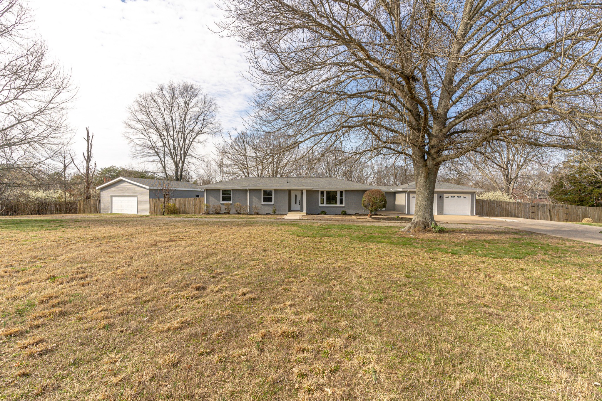 7302 Henry Road Fairview, TN 37062 - Photo 1 of 69 a front view of a house with a yard