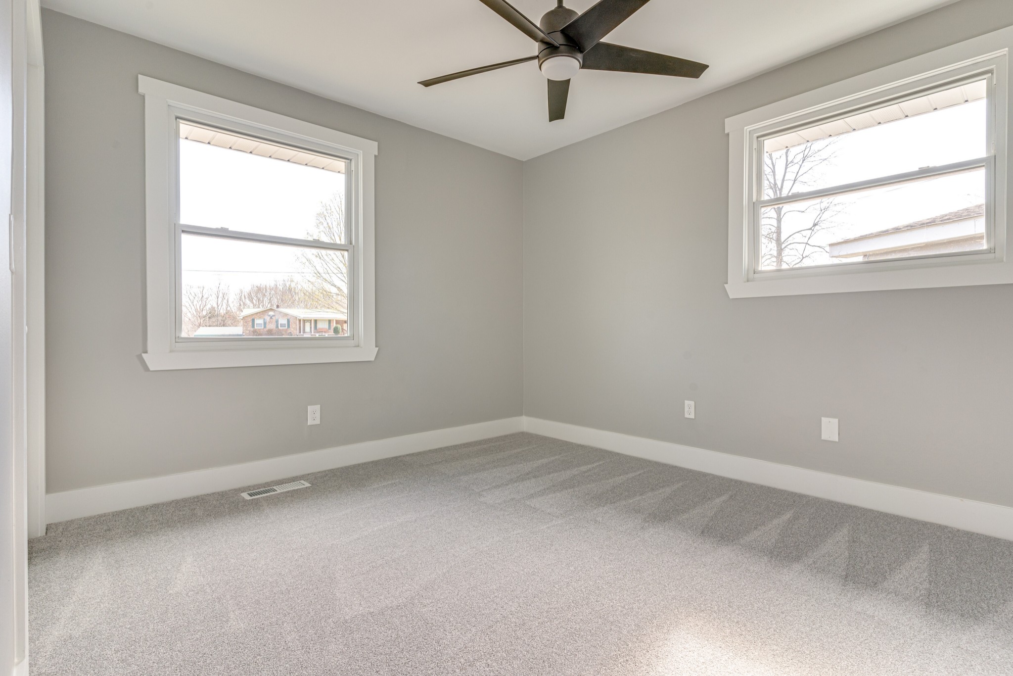 7302 Henry Road Fairview, TN 37062 - Photo 22 of 69 an empty room with a window and a fan