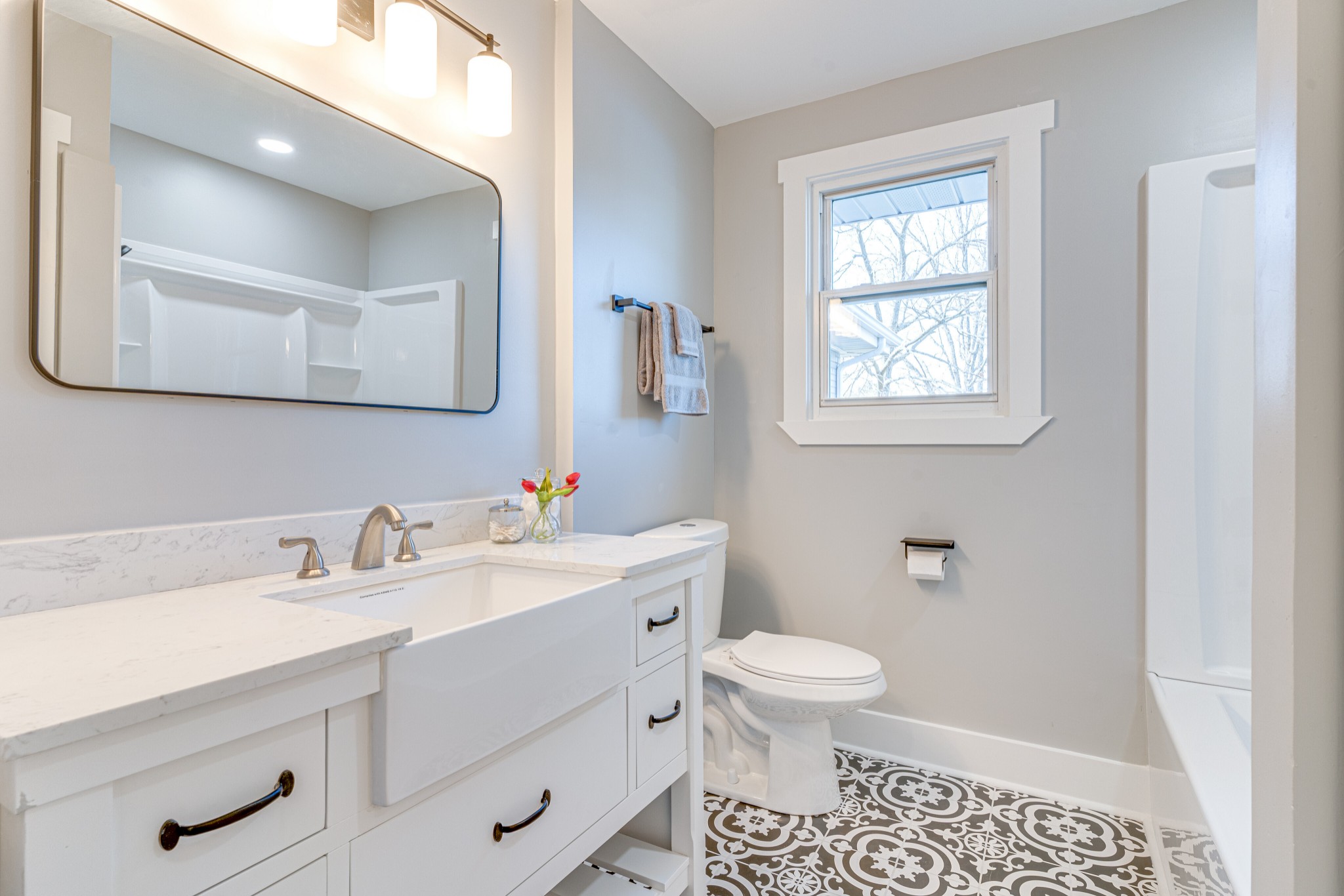 7302 Henry Road Fairview, TN 37062 - Photo 29 of 69 a bathroom with a sink a toilet and a mirror