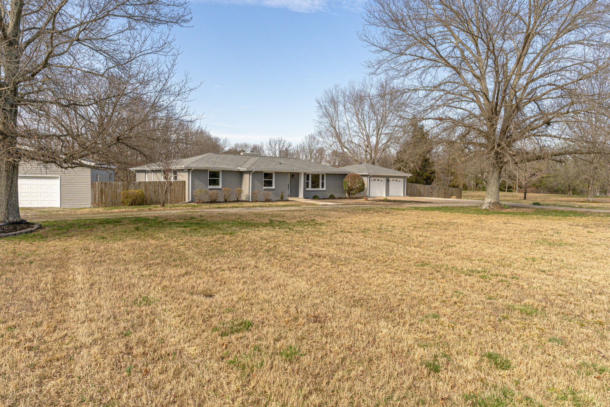 7302 Henry Road Fairview, TN 37062 - Photo 3 of 69 a front view of residential houses with yard and trees