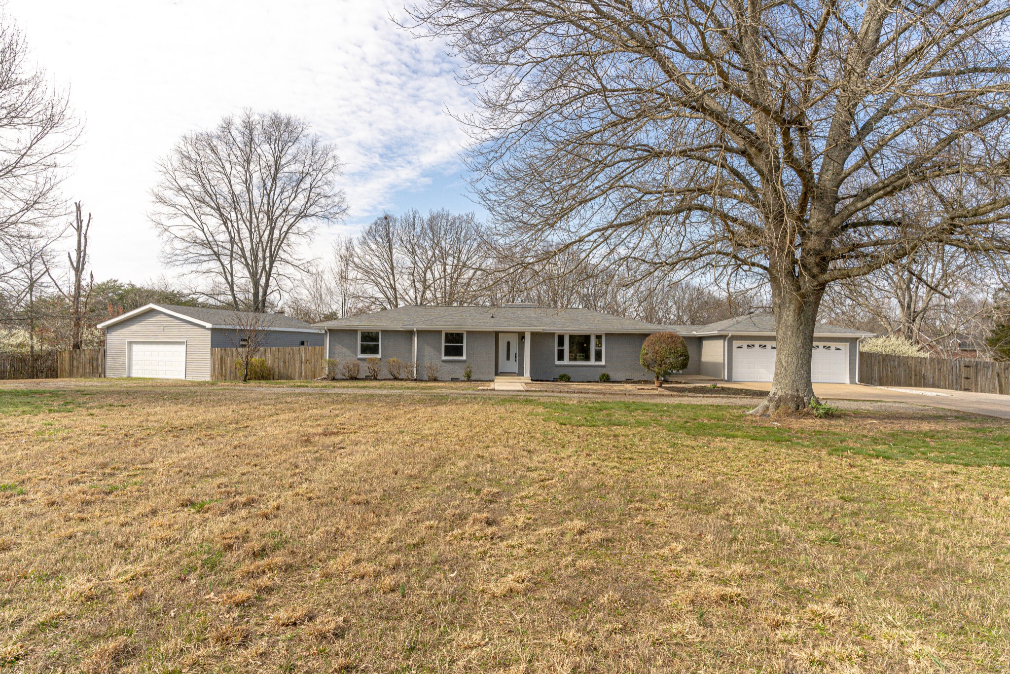 7302 Henry Road Fairview, TN 37062 - Photo 4 of 69 a front view of a house with a yard